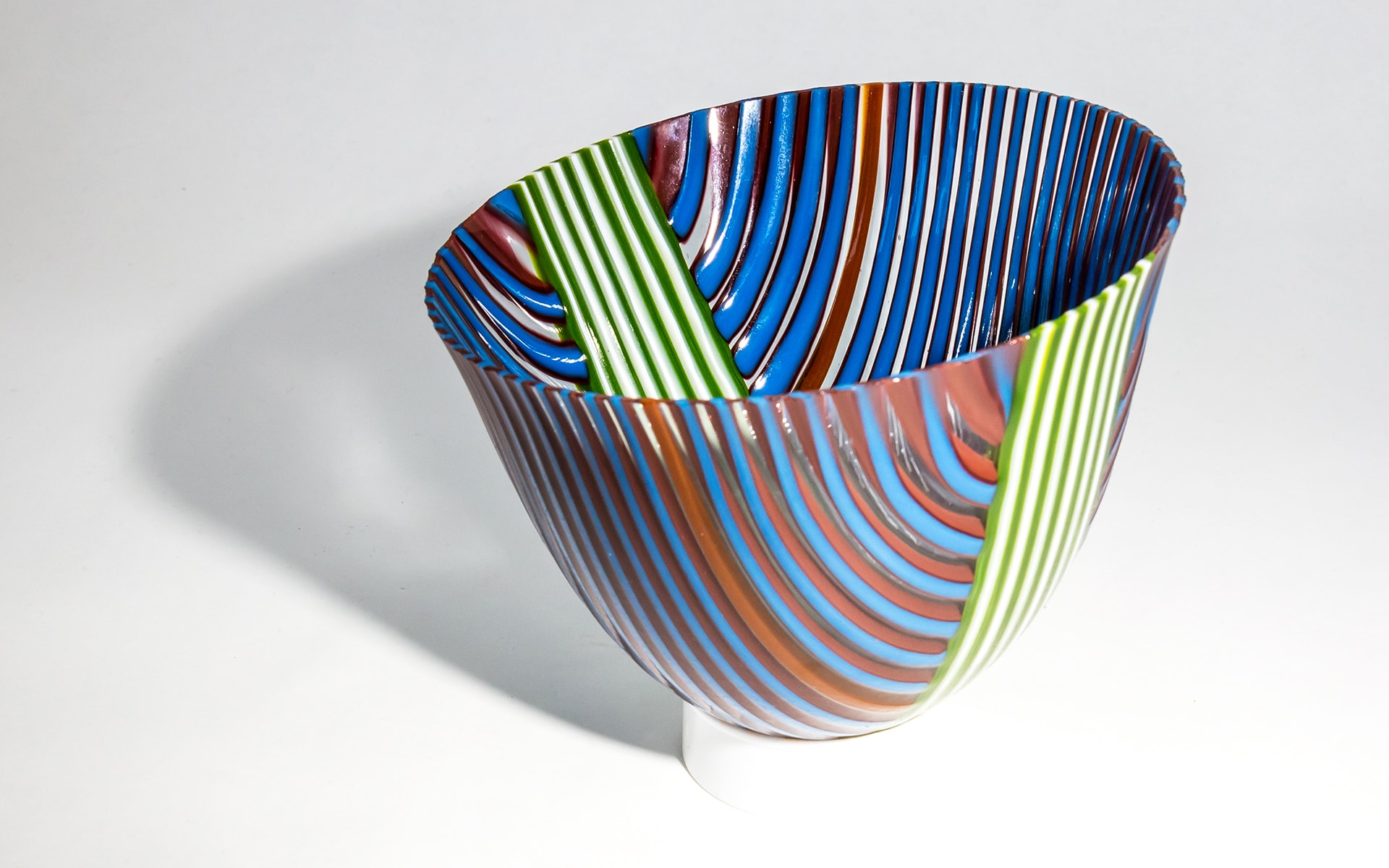 Fused glass drop out, with bold multicolor diagonal stripes. Private Collection