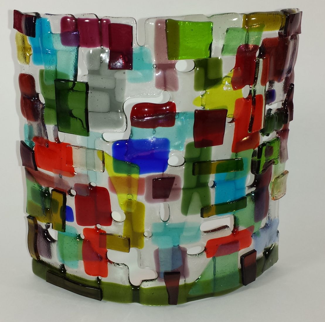 Curved fused glass sconce cover made with scrap glass